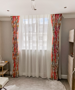 red ceiling height curtains and net curtains